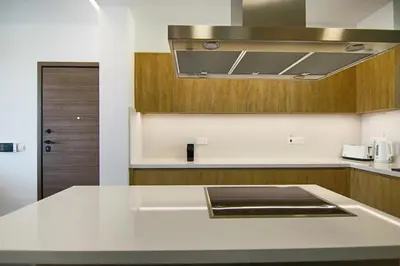 a kitchen with a white counter top and a sink at Phaedrus Living: City View Anna Residence 102 in Limassol