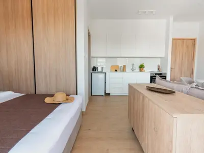 a room with a bed with a hat on top of it at Armonta Residences by BeCyprus in Limassol