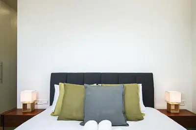 a bedroom with a bed with two lamps on it at Phaedrus Living: Sea View Anna Residence 202 in Limassol