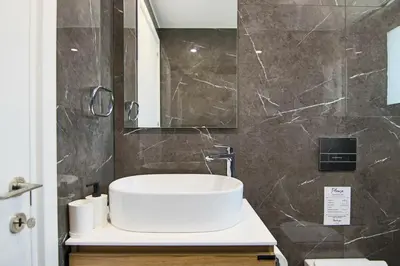a bathroom with a sink and a mirror at Phaedrus Living: Sea View Anna Residence 202 in Limassol