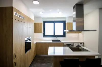 a kitchen with a sink and a window in it at Phaedrus Living: Sea View Anna Residence 301 in Limassol
