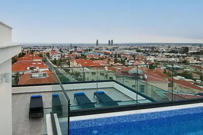a swimming pool on the roof of a building at Phaedrus Living: Sea View Anna Residence 301 in Limassol