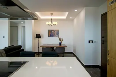 a living room with a table and a couch at Phaedrus Living: Sea View Anna Residence 301 in Limassol