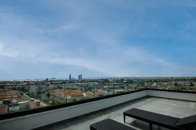 a balcony with a view of a city at Phaedrus Living: Sea View Anna Residence 302 in Limassol