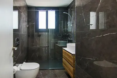 a bathroom with a shower and a toilet and a sink at Phaedrus Living: Sea View Anna Residence 302 in Limassol