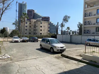 a group of cars parked in a parking lot at 1 bedroom flat 200m from the beach in germasogia tourist area in Limassol
