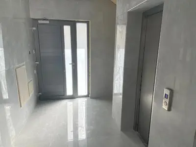 an empty hallway with a door in a building at 1 bedroom flat 200m from the beach in germasogia tourist area in Limassol