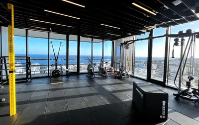 an empty gym with a view of the ocean at ICON - Private Holiday Apartments in Limassol