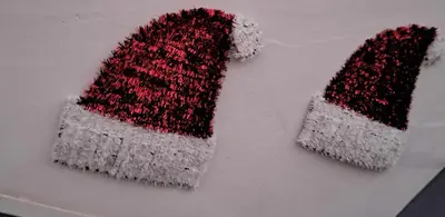 two hats are sitting on a table at Lovely Cozy Apartment in the entrance of Nicosia in Aglantzia