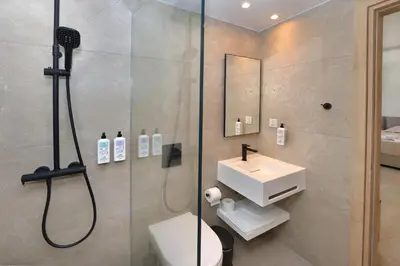 a bathroom with a shower and a sink at Panas Villas in Ayia Napa