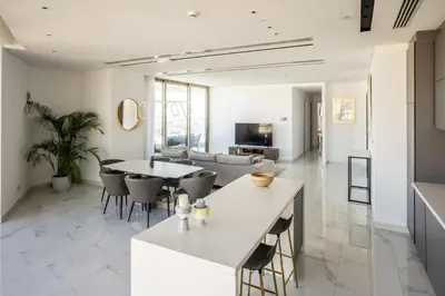 a kitchen and living room with a table and chairs at 360 Nicosia - Luxury Apartment Panoramic View in Nicosia