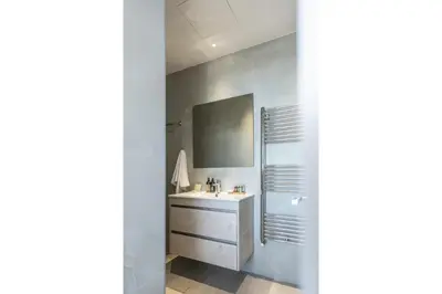 a bathroom with a sink and a mirror at 360 Nicosia - Luxury Apartment Panoramic View in Nicosia