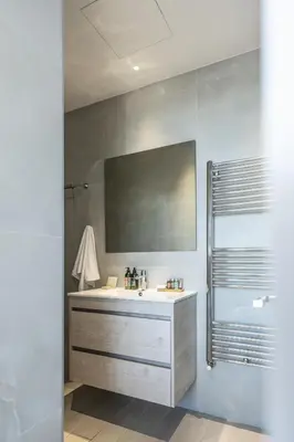 a bathroom with a sink and a mirror at 360 Nicosia - Luxury Apartment Panoramic View in Nicosia