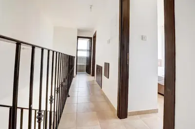a hallway of a house with white walls and a staircase at Crystal 12 Kapparis 3Bedroom Villa in Paralimni