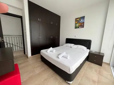 a bedroom with a bed with two pillows on it at Crystal 12 Kapparis 3Bedroom Villa in Paralimni