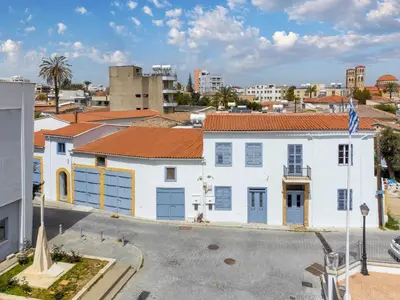 an aerial view of a white building with blue doors at To Hani - Kamara Maisonette in Nicosia