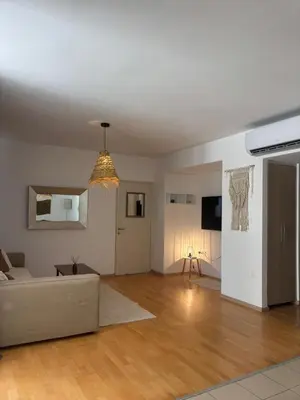 a living room with a couch and a table at Hestia Living in Scala