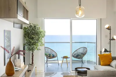 a living room with a view of the ocean at Lovely 3-bedroom apartment in Prokymea court in Limassol
