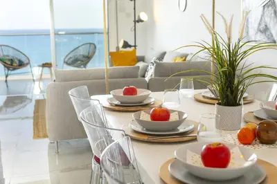 a dining room table with plates of fruit on it at Lovely 3-bedroom apartment in Prokymea court in Limassol