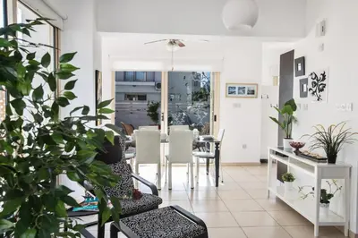 a living room with plants and a table at Palm Villa 17 in Protaras
