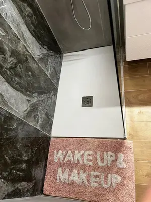 a sign that says wake up and make up in a bathroom at Ayia napa rest in Ayia Napa