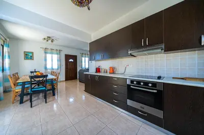 a kitchen with a table and a dining room at Anna-Maria 3 bedroom villa in Paralimni