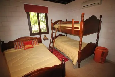 a bedroom with two bunk beds and a window at House of Roses in Limassol