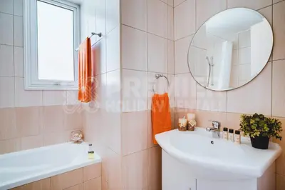 a bathroom with a sink and a mirror at Villa Seaview in Protaras