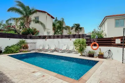 a swimming pool in front of a house at Villa Seaview in Protaras