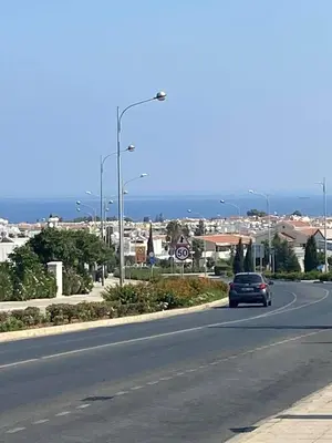 a car driving down a road in a city at Paralimni in Paralimni