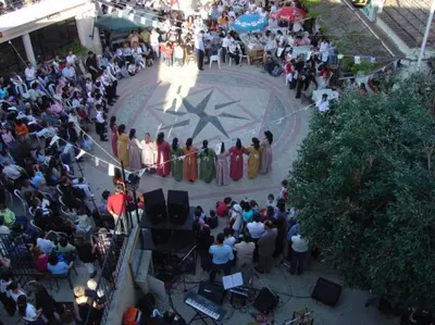 a crowd of people watching a performance in aestival at Katikies 19 in Pissouri