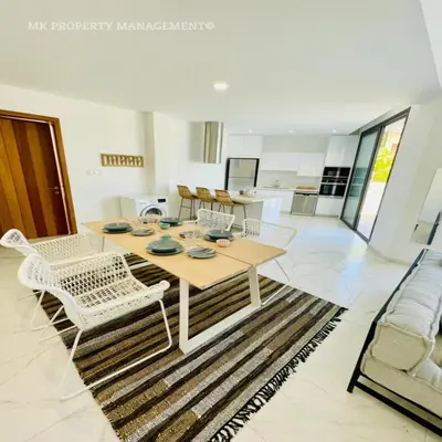 a dining room with a table and chairs at By the Beach Villa 7 in Protaras