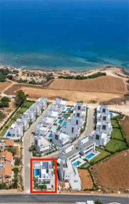 an aerial view of a resort near the ocean at By the Beach Villa 7 in Protaras