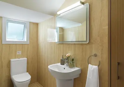 a bathroom with a sink and a toilet and a mirror at LuxVillasRentals Ayia Napa in Ayia Napa