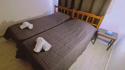 two towels on a bed in a bedroom at STAY Chill n' Joy in Ayia Napa