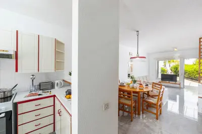 a kitchen and a dining room with a table at Maistralli Villa in Protaras