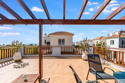 a view from the deck of a house with a patio at Villa Rosedale by Ezoria Villas in Ayia Napa