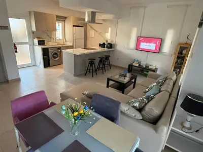a living room with a couch and a table at Villa Diana - 200 meters from Kapparis, Fireman's Beach in Paralimni