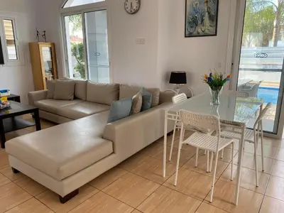 a living room with a couch and a table at Villa Diana - 200 meters from Kapparis, Fireman's Beach in Paralimni