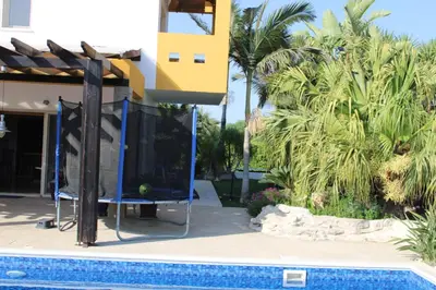 a house with a swimming pool next to a house at Immaculate 3-Bed House in Pentakomo in Pendakomo