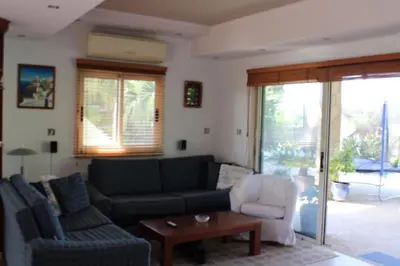 a living room with a couch and a table at Immaculate 3-Bed House in Pentakomo in Pendakomo