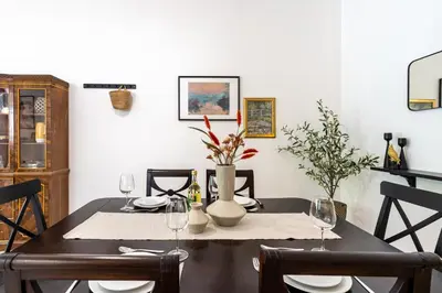 a dining room with a table with two chairs at Arty Haven - Spacious 3-BR House in Larnaca in Larnaka