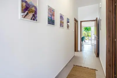 a hallway with paintings on the walls of a house at Arty Haven - Spacious 3-BR House in Larnaca in Larnaka