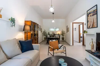 a living room with a couch and a table at Arty Haven - Spacious 3-BR House in Larnaca in Larnaka