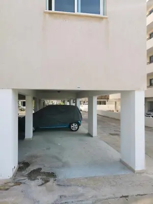 a car is parked under a parking lot at Carisa DownTown with Rooftop pool in Larnaka