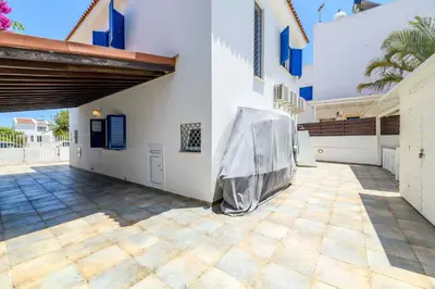 a house with a cover on the side of it at Villa Serena Springs by Ezoria Villas in Protaras