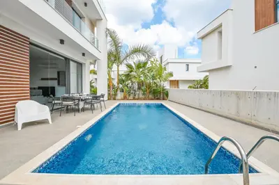 a swimming pool in the backyard of a house at By the Beach Villa 12 in Protaras