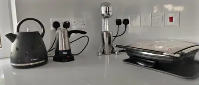 a kitchen counter with a blender and a toaster at anemelie in Sotira