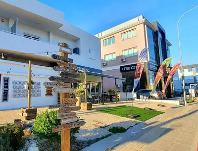 a street sign in front of a building at Kalidonia “PANORAMA” STUDIO APARTMENT in Engomi