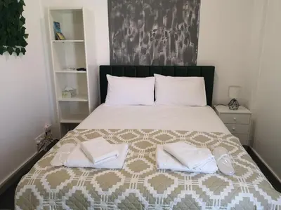 a bedroom with a bed with two towels on it at Kalidonia “PANORAMA” STUDIO APARTMENT in Engomi